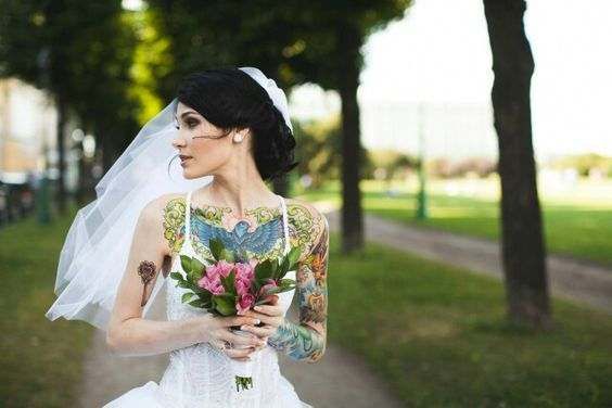A very beautiful bride with tattoos
